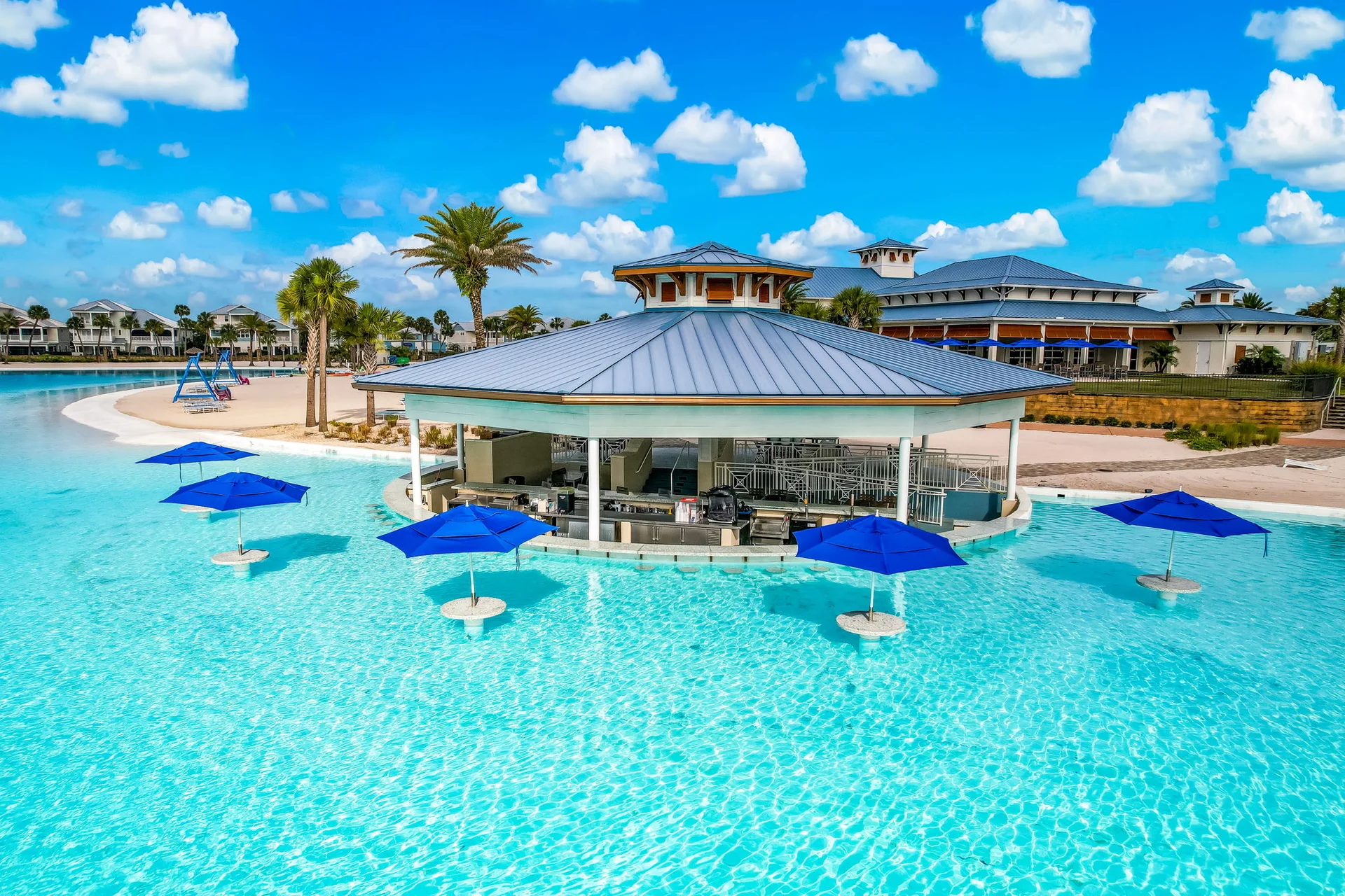Open-air bar set within the shallow water at Beachwalk Club