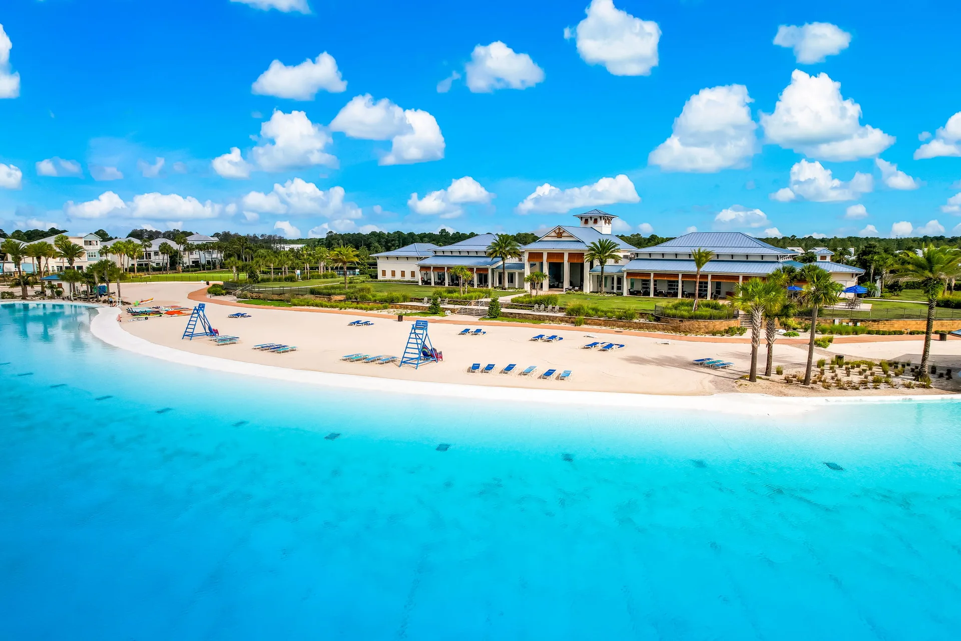 Aerial view across the Beachwalk lagoon toward the clubhouse and sandy beach