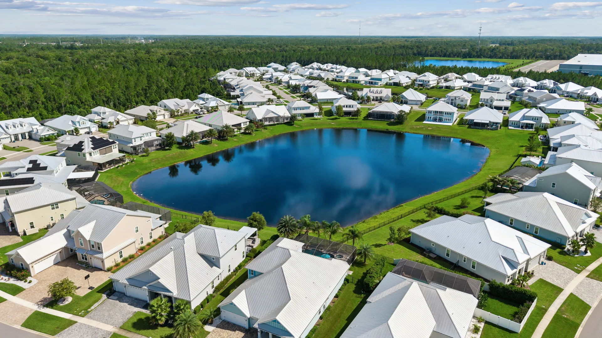 Aerial view of Seaside Estates homes and ponds within the Beachwalk community